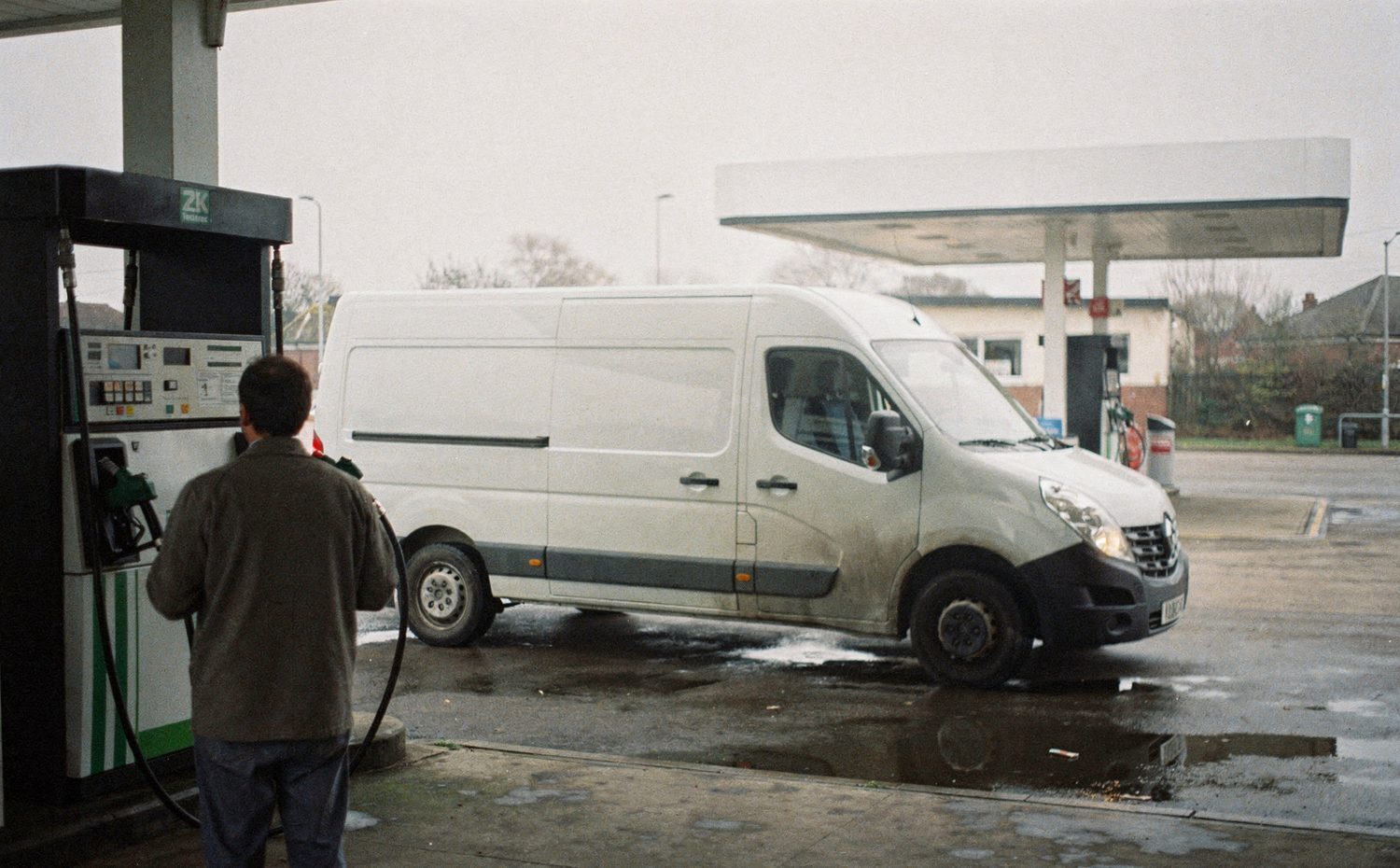 A delivery van refuelling at a UK forecourt